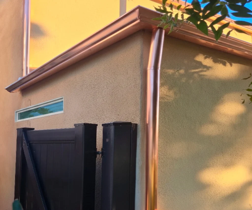 copper-gutter-k-style Copper gutter installed in K-Style format, together with copper downspouts.