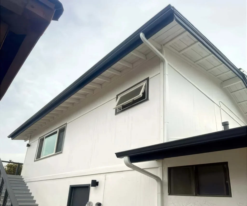 Double gutters installed with downspouts