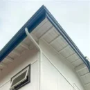 Gutter installed on a two-story house