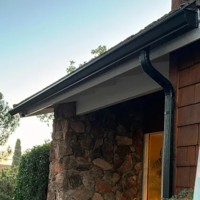 K-style gutter installed with corrugated downspout